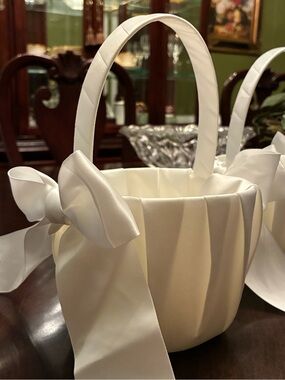 Elegant White Satin Flower Girl Basket with Bow and petals.